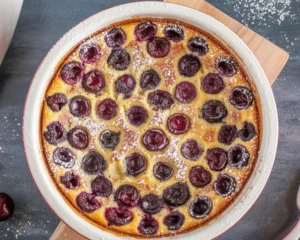 Traditional Clafoutis aux cerises with fresh cherries and flan-like batter.
